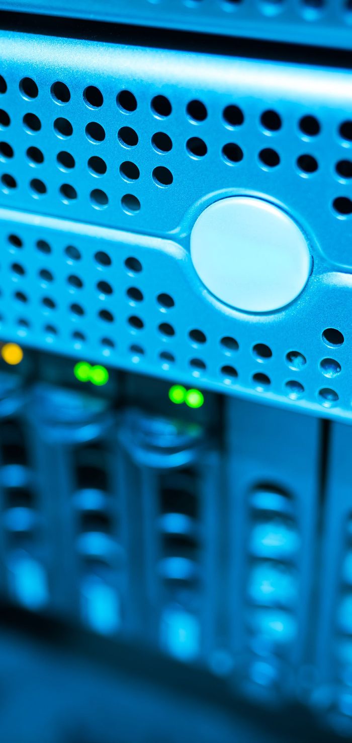 Blue-lit server rack representing AI infrastructure and shadow AI risk