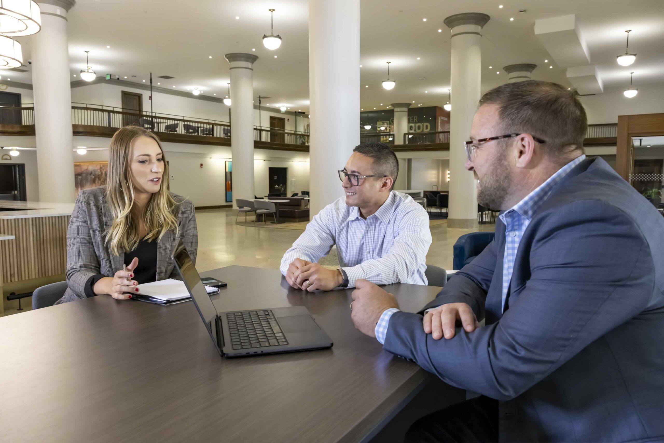 Cottingham & Butler team meeting in their office lobby